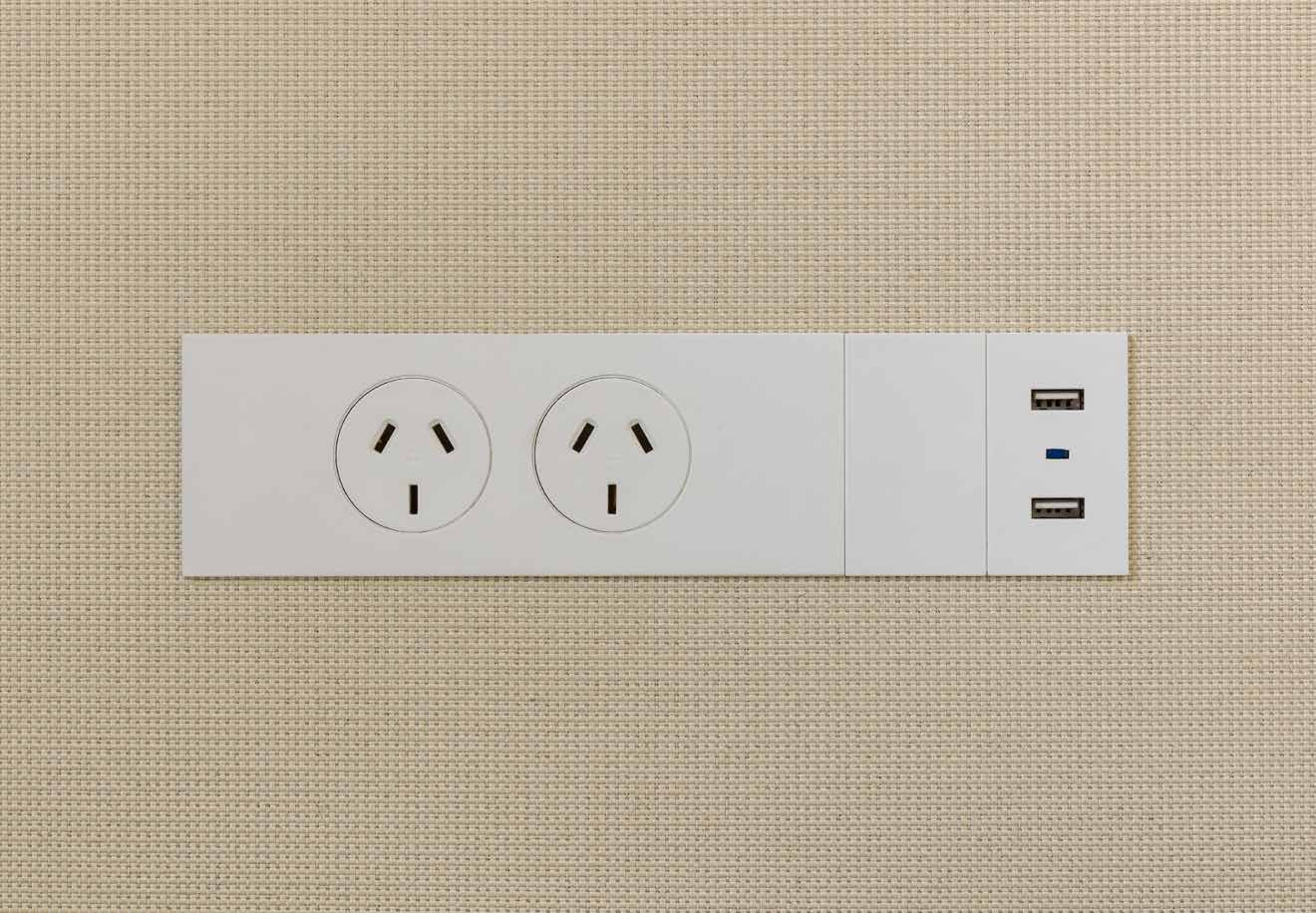 Integrated power outlet tile