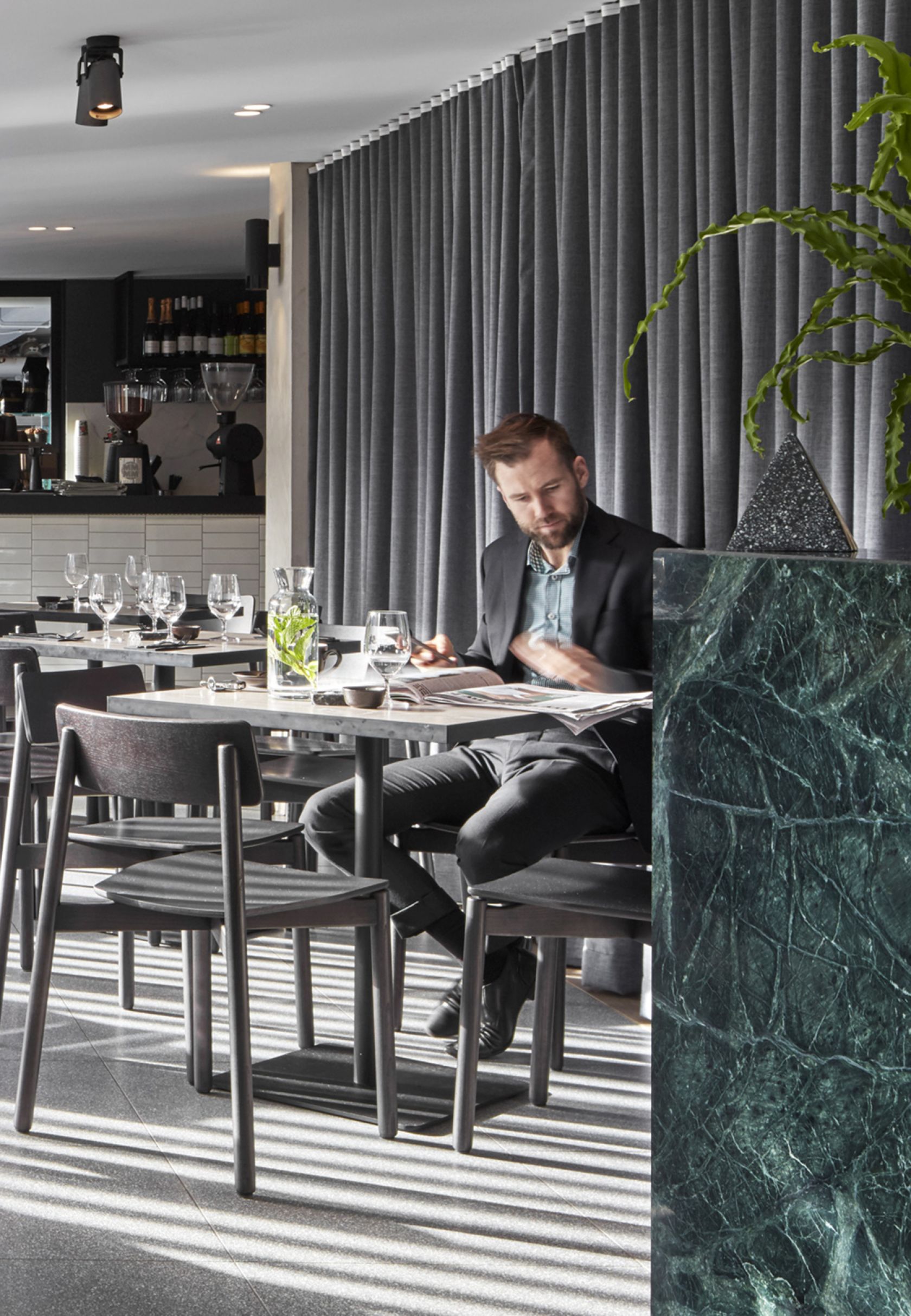 person, sitting, dining table, table, restaurant, dining room, interior design, adult, male, man