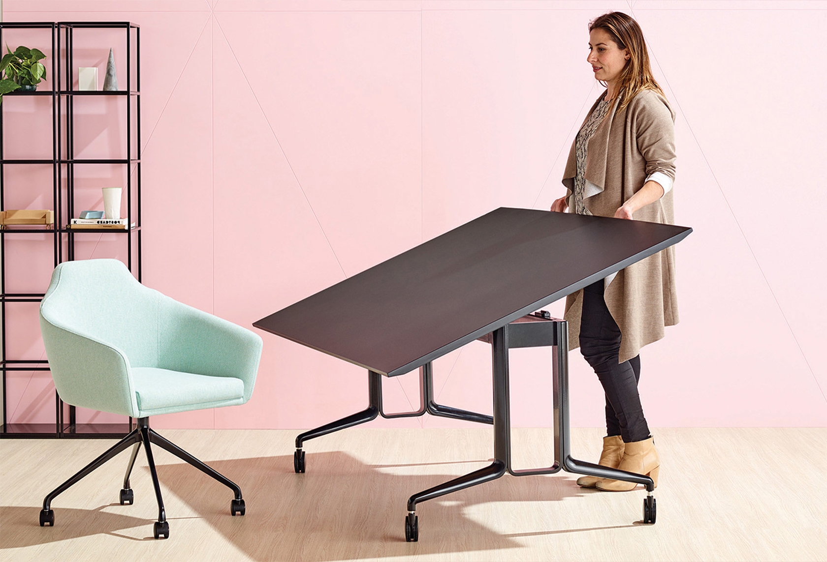 furniture, table, desk, chair, person, clothing, jeans, pants