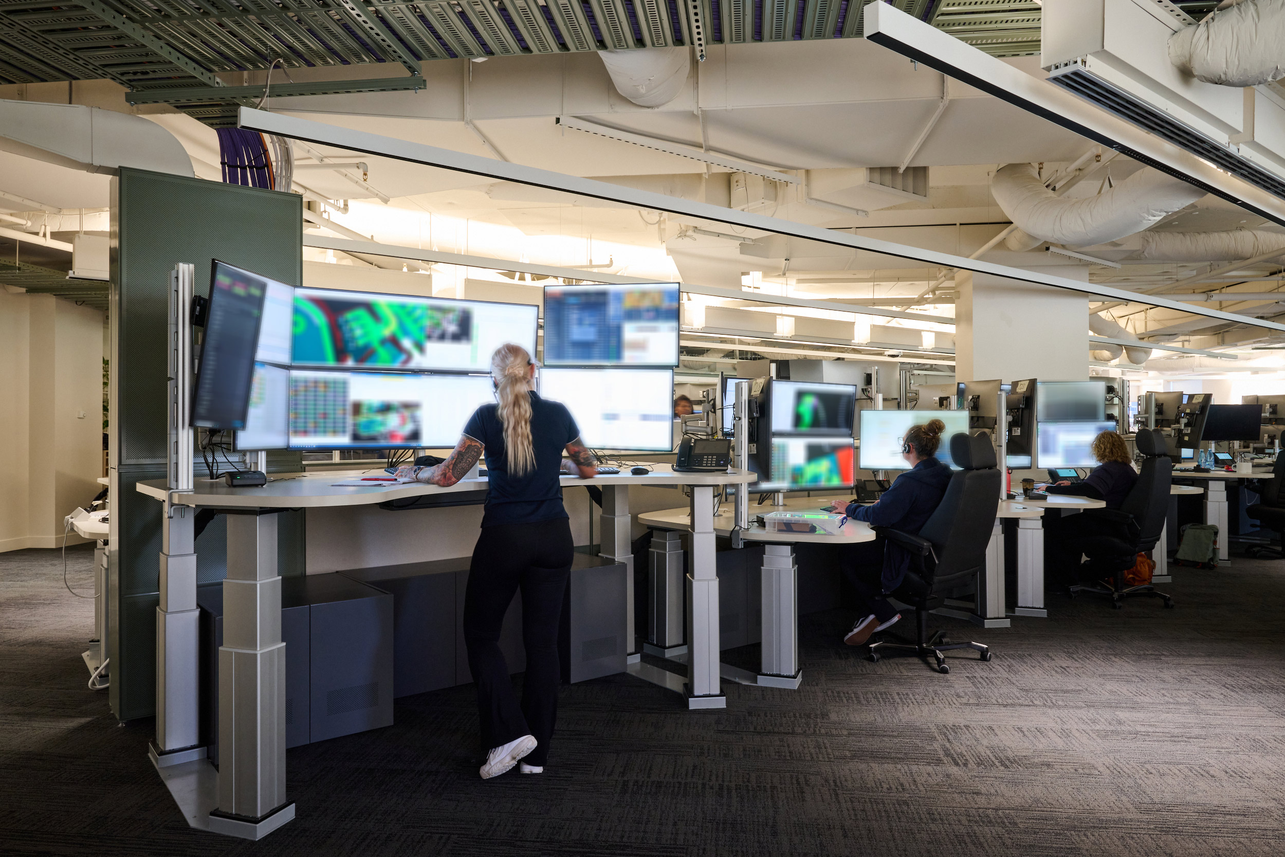 furniture, table, desk, adult, female, person, woman, shoe, chair, monitor